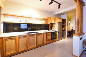 Deluxe Studio, Garden View | Private kitchen - Castle Residence by Aura  (Paje)