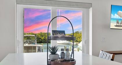 Waterfront Escape with Pool, Tiki, Breakfast & Marina