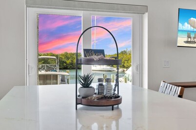 Waterfront Escape with Pool, Tiki, Breakfast & Marina