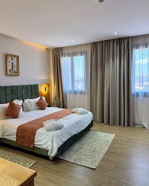 Chambre Deluxe double ou avec lits jumeaux | Literie de qualité, minibar, bureau