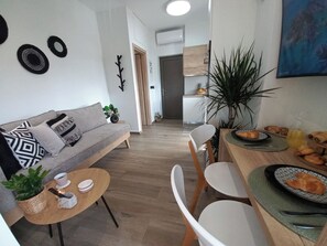 Living area - Renovated seaside apt for couples: sea view, full kitchen & Wi-Fi. (Kato Gouves)
