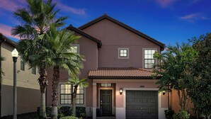 A two-story house with a brown facade, a tiled roof, and a front garage door. - 5424 Solterra Circle, Davenport,5beds (Davenport)