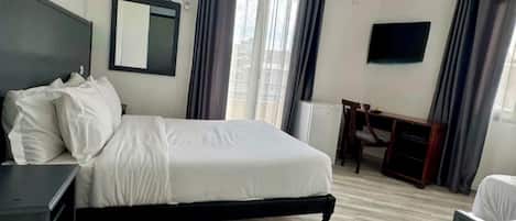 Standard Double or Twin Room | Desk, laptop workspace, blackout drapes, rollaway beds