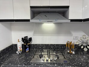 Private kitchen - RoyalApartment inExtension ofAmerican University (New Cairo)