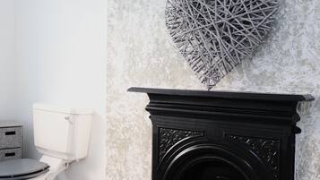 Separate tub and shower, towels, toilet paper