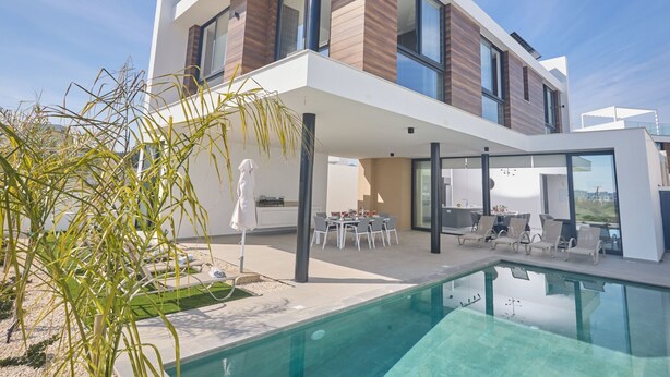 A modern two-story house with a swimming pool, outdoor dining area, and a covered patio. - Protaras Aqua Pearl Villa AQ12 by Interhome (Protaras)
