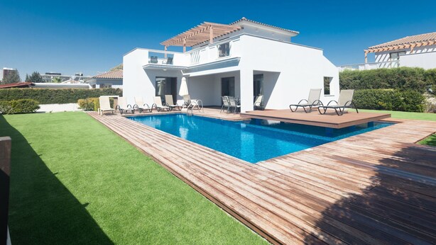 A modern two-story house with a swimming pool, a wooden deck, and a well-maintained lawn. - Ayia Napa Satin Villa SVI3 by Interhome (Ayia Napa)