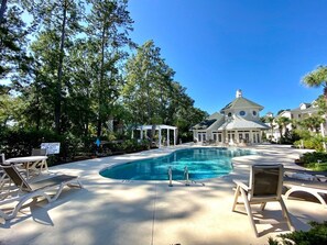 A pool area with lounge chairs, a gazebo, and a building with a dome roof. - World Tour 306b (Myrtle Beach)