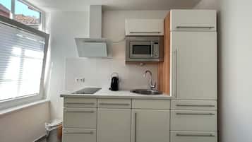 Fridge, oven, cookware/dishes/utensils