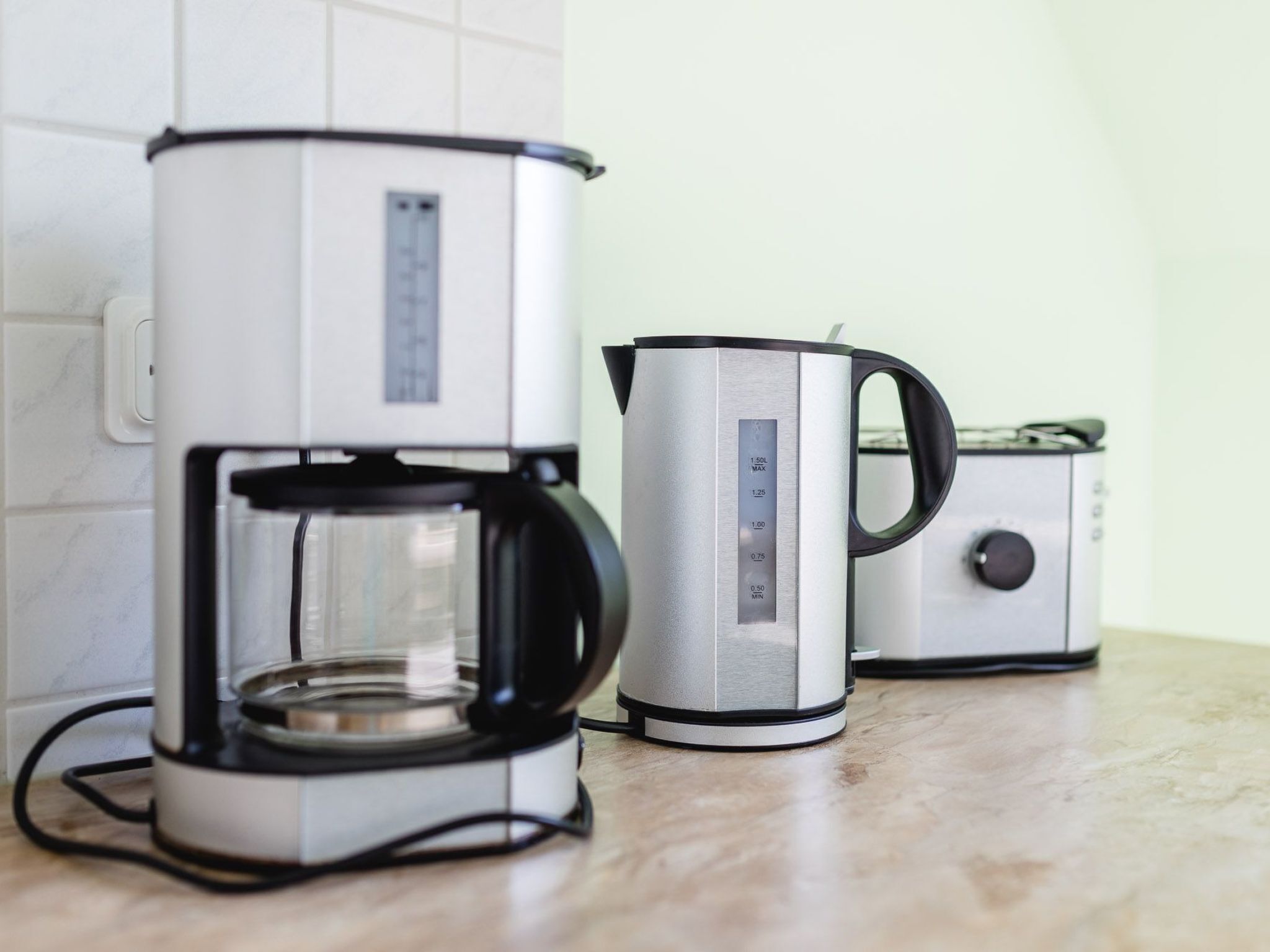 A kitchen with a coffee maker and a toaster.