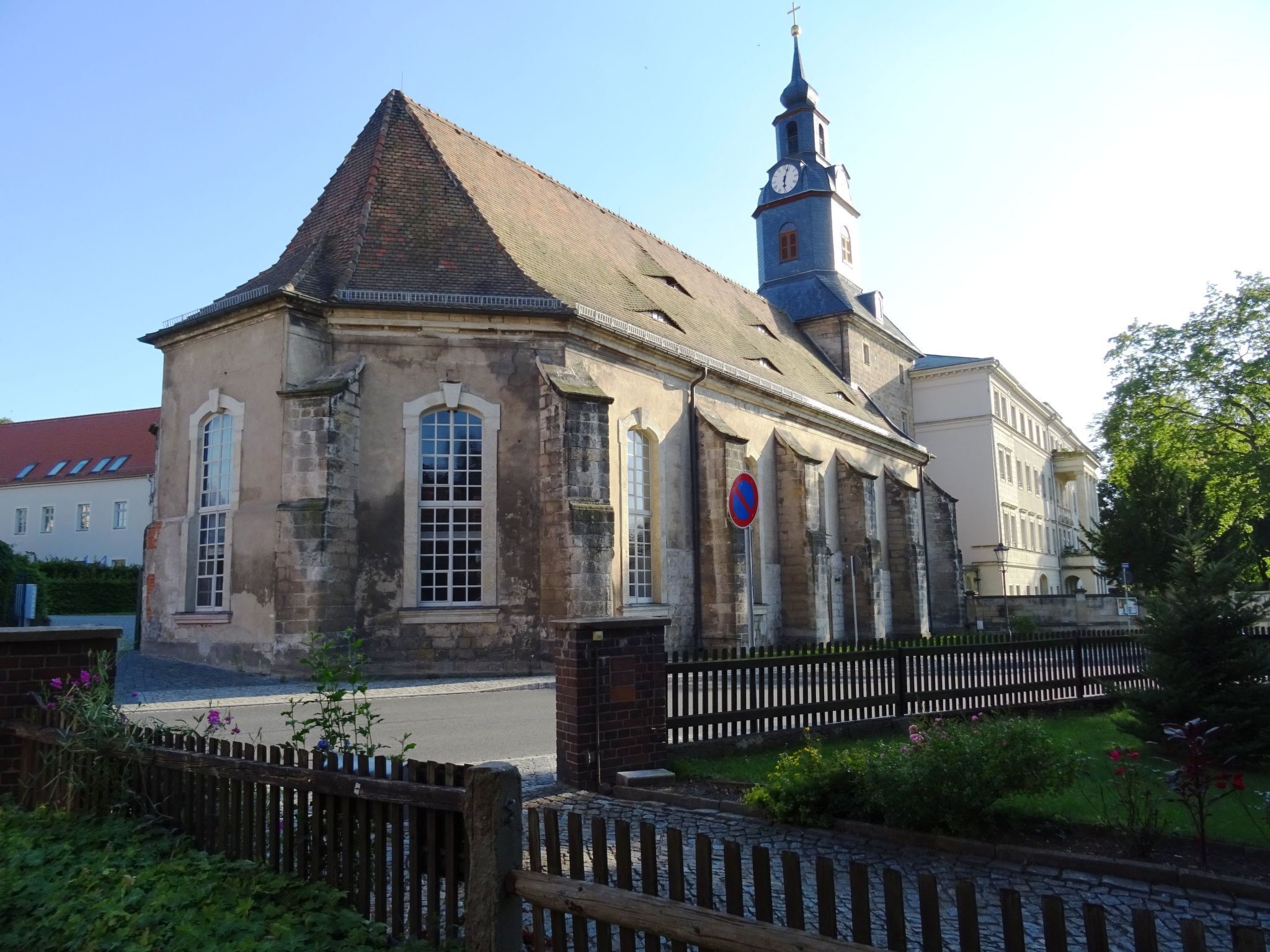 A historic building with a prominent clock tower and a traditional architectural style.