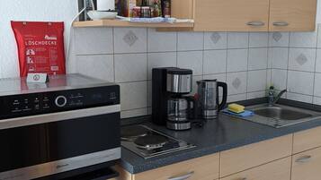 Fridge, microwave, oven, cookware/dishes/utensils