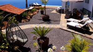 A resort with a pool, lounge chairs, and a view of the ocean. - Moderne Architekten-Villa mit Infinity-Pool und Meerblick by Interhome (Puntagorda)