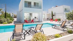 A modern two-story house with a swimming pool, outdoor seating, and a well-maintained garden. - Protaras Greco Villa CCV1 mit beheiztem Pool by Interhome (Paralimni)