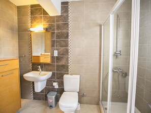 A bathroom with a sink, toilet, and shower. - Schöne Wohnung am Meer by Interhome (Protaras)