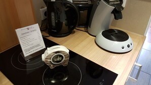 A coffee machine, a kettle, and a small appliance on a countertop. - Apartment Oliver by Interhome (Fritzlar)