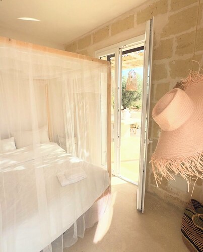 Design-led masseria with infinity pool: vineyards, olives, beaches & Puglia