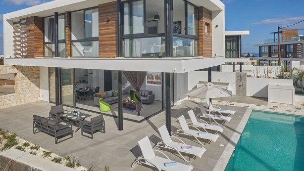 A modern two-story house with a pool, outdoor seating, and a dining area. - Protaras Elite Perle Villa EP3C by Interhome (Protaras)