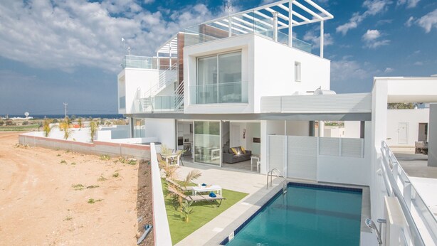 A modern two-story house with a glass balcony, a swimming pool, and a view of the sea. - Protaras Villa mit privatem Pool und Dachgarten by Interhome (Protaras)
