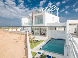 A modern two-story house with a glass balcony, a swimming pool, and a view of the sea. - Protaras Villa mit privatem Pool und Dachgarten by Interhome (Protaras)