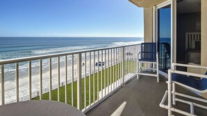 A balcony with a view of the beach and ocean. - Oceania Beach Club 504 (New Smyrna Beach)