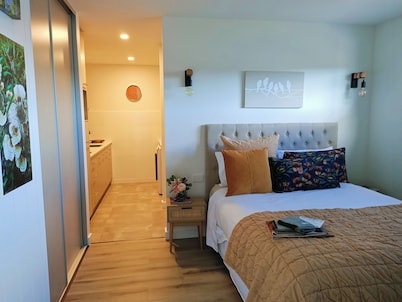Cosy 1 Bedroom Unit with separate living space, laundry and kitchen.