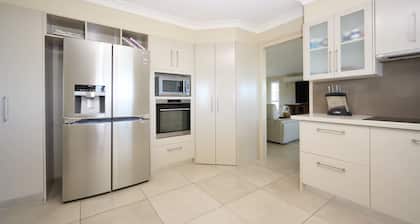 Family Coastal Retreat with Pool and Balcony Views