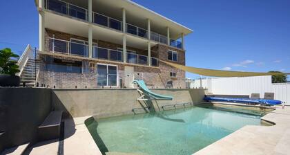 Family Coastal Retreat with Pool and Balcony Views