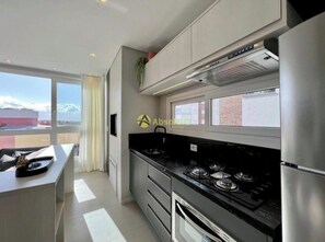 Private kitchen - Beautiful and new luxury apartment in the best area of Capão da Canoa. (Capão da Canoa)
