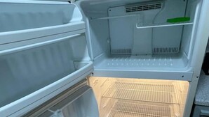 An open refrigerator with multiple shelves and a freezer compartment. - Blue&pink#3 Pool Centralphx (Phoenix)