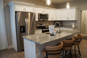 Fridge, microwave, oven, stovetop - Gateway Gathering | Spacious 4BR Home with Game Room Near Downtown & UNL (Lincoln)