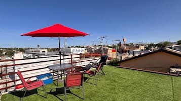 Deluxe Apartment, Balcony, City View | Outdoor dining