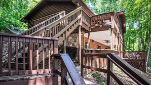 A wooden cabin with multiple levels and a staircase. - Dogwood Cabin (Martin)