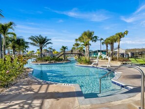 A swimming pool with a 3 ft depth marker, surrounded by palm trees and a wooden deck. - Nrl4543 (Kissimmee)