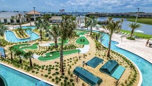 A resort with a large swimming pool, a golf course, and a beach area. - 4300pw · Brand New Storey Lake 8BR Villa With Lake View (Kissimmee)