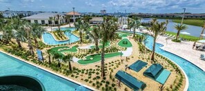 A resort with a large swimming pool, a golf course, and a beach area. - 4300pw · Brand New Storey Lake 8BR Villa With Lake View (Kissimmee)