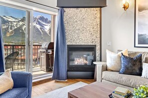 TV, fireplace - Stunning Penthouse w/ Mtn Views, Hot Tub & Pool! (Canmore)