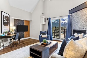 TV, fireplace - Stunning Penthouse w/ Mtn Views, Hot Tub & Pool! (Canmore)