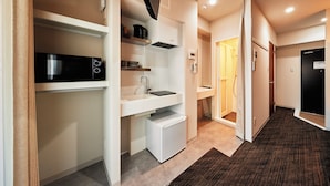 A compact kitchen with a microwave, sink, and small refrigerator. - Moat Inside Tenjin (Fukuoka)