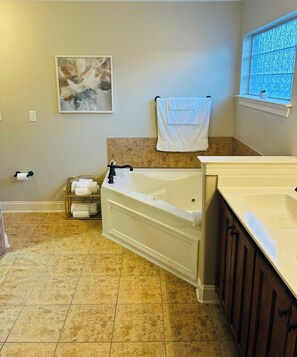 Jetted bath, hair dryer, towels, soap