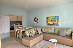 Family Apartment, Multiple Bedrooms, 2 Bathrooms (Lura 2 Holiday Homes 127) | Living area | 21-inch TV with cable channels