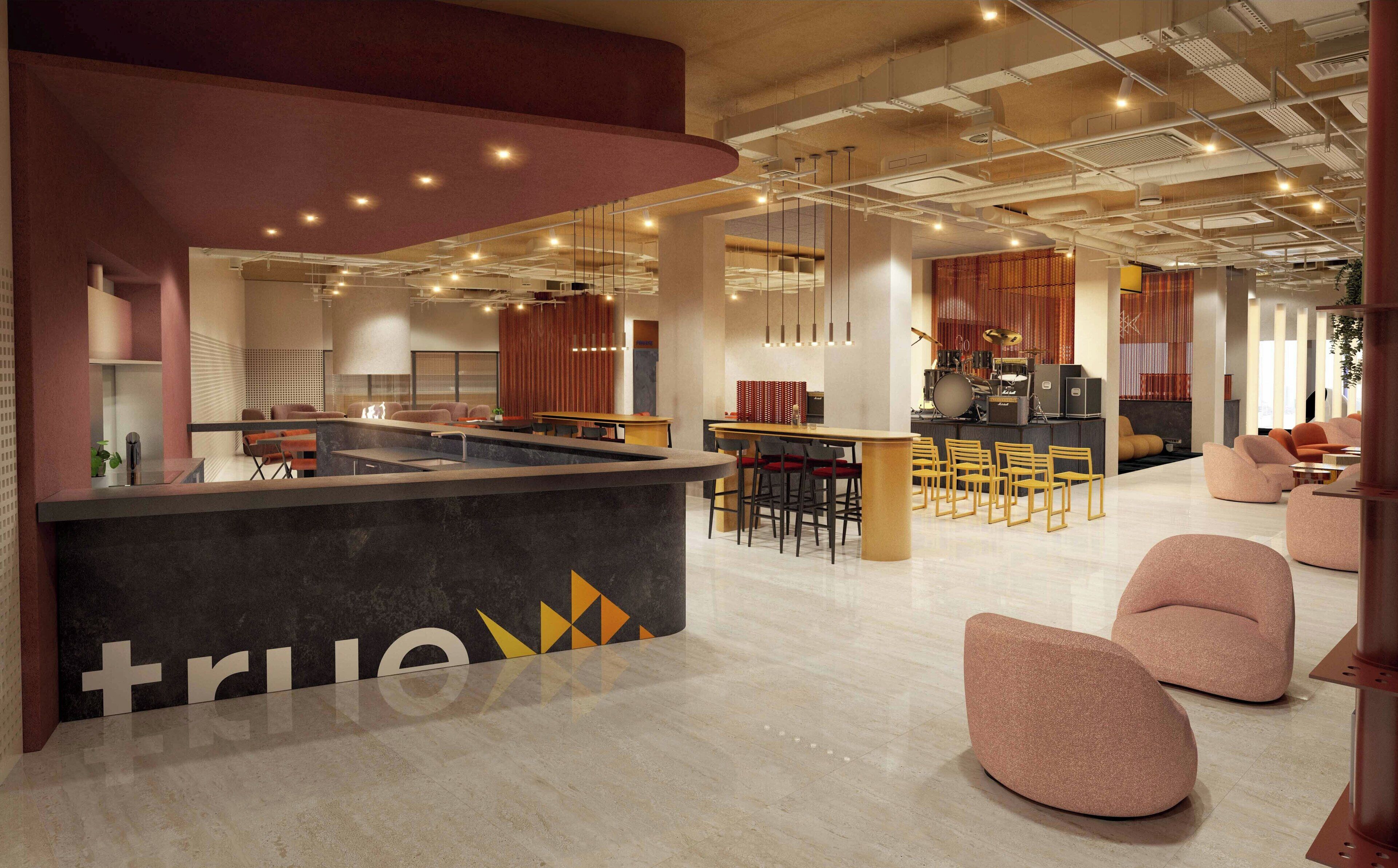 A modern interior with a reception desk, seating area, and a stage with musical instruments.