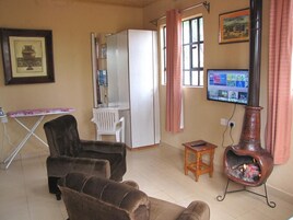 Business Apartment | Living area | 32-inch Smart TV with digital channels