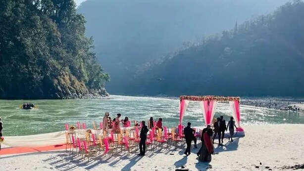 A beachside event with a tent and chairs set up for guests. - The Shivaay AIIMS by Lovely Hospitality (Rishikesh)