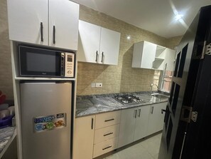 Basic Apartment, City View | Private kitchen | Cookware/dishes/utensils - B12  Apartment (Lagos)