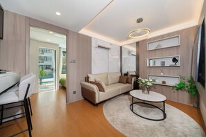 Pool Access Suite | Living area | Flat-screen TV - Capri Residence Bangtao (Choeng Thale)