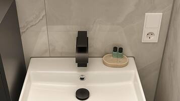 Dusj, hårføner, håndklær og sjampo