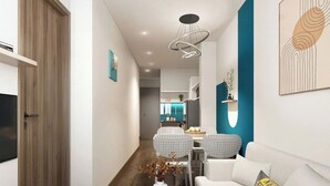A modern living room with a sofa, a coffee table, and a dining area with chairs. - Lumiere Urban Apartment (Ho Chi Minh City)
