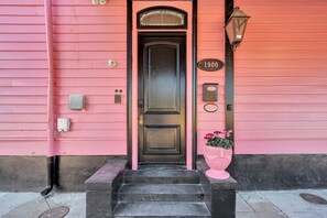 Exterior detail - Enjoy a comfortable and private 1BR suite on historic Rampart Street. Enjoy playful décor, a comfy queen bed, en-suite bath, and access to a communal lobby. (New Orleans)