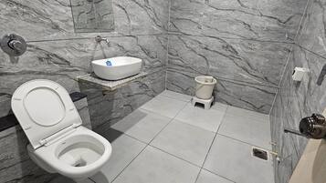 Deluxe Double Room, City View | Bathroom | Shower, slippers, towels, soap